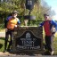 Success: Simon and Tim take the weight off at Tenby after 104 miles on the road.